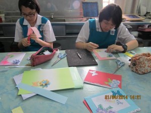 They were making their cards with materials provided.